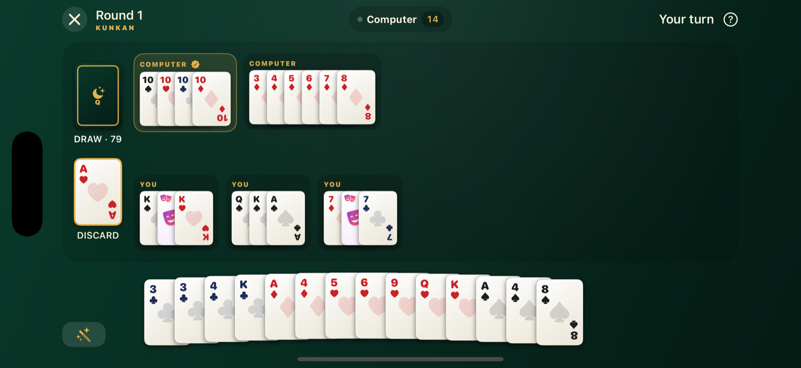 A Qamar game in progress: melds laid out on the green felt table, a hand of cards along the bottom.